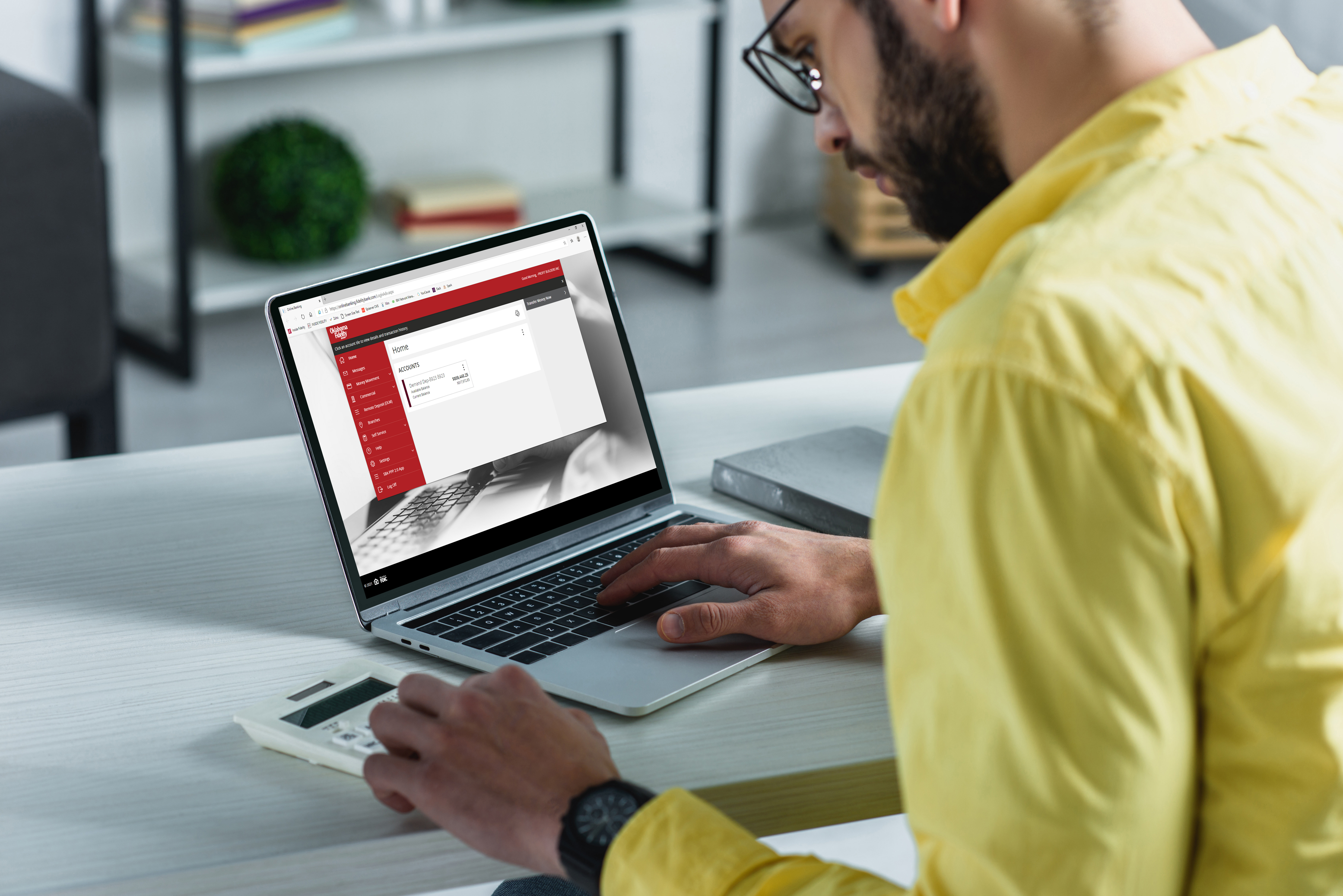 Man accessing commercial online banking on laptop