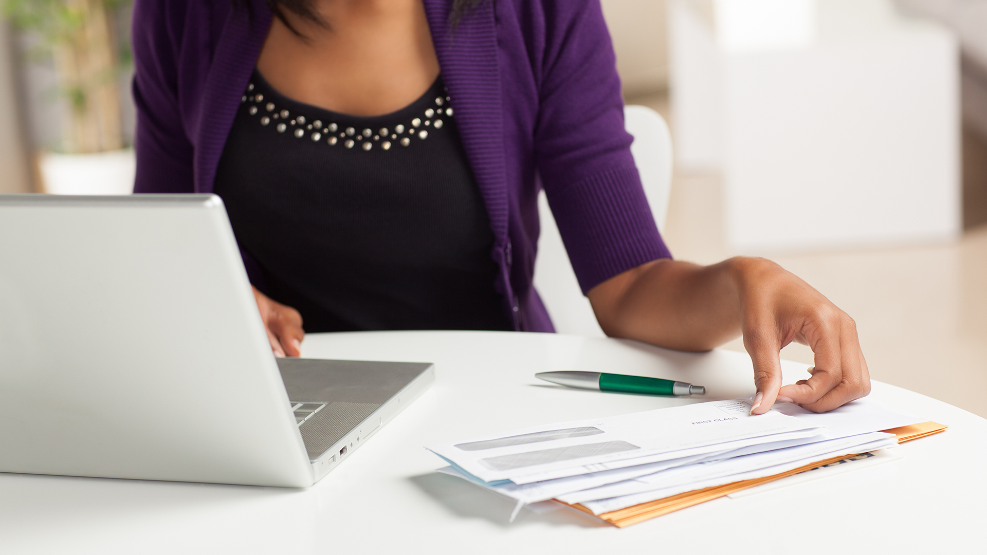 Woman paying bills online